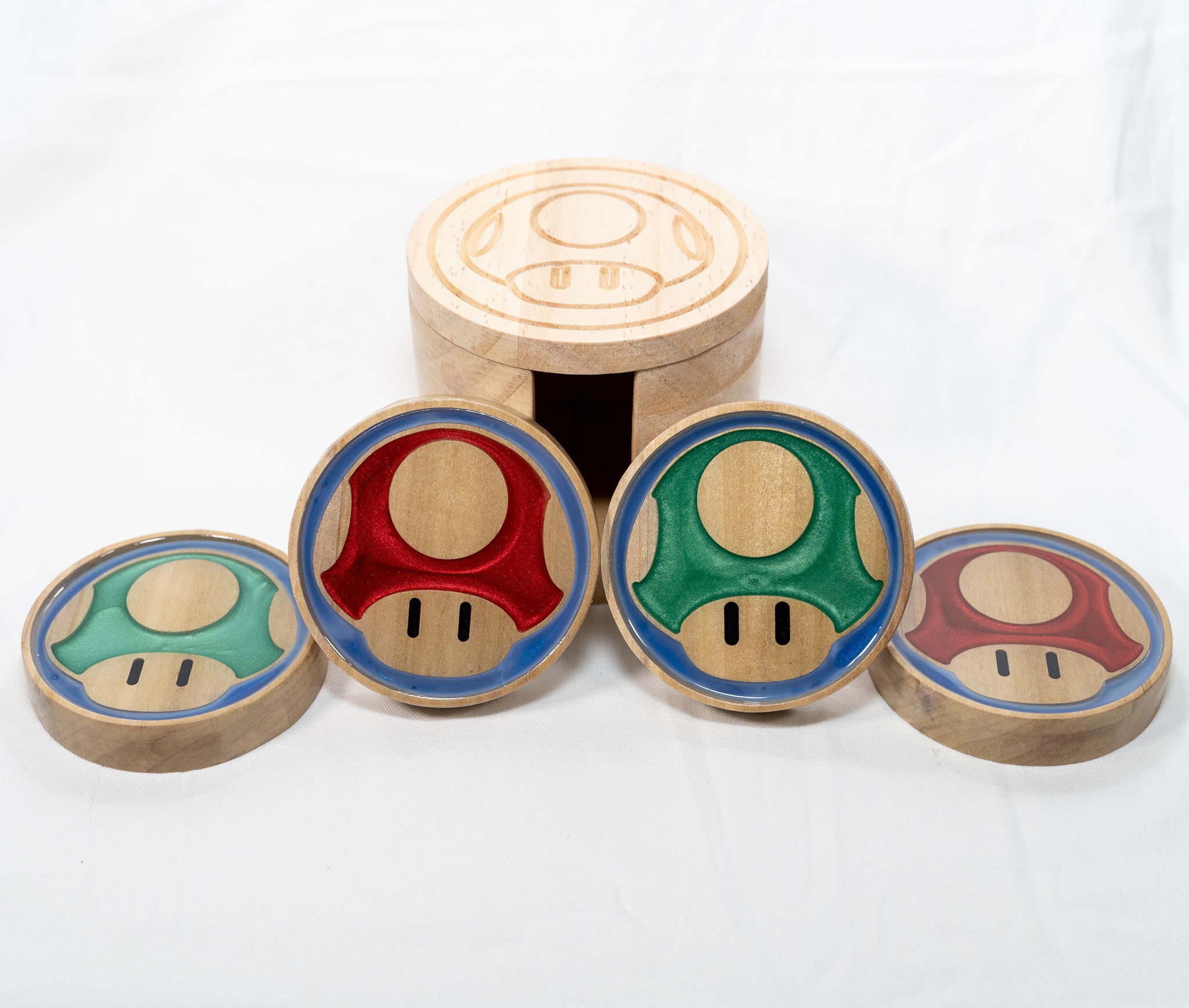 A set of poplar wood green and red mushroom coasters from the mario video game