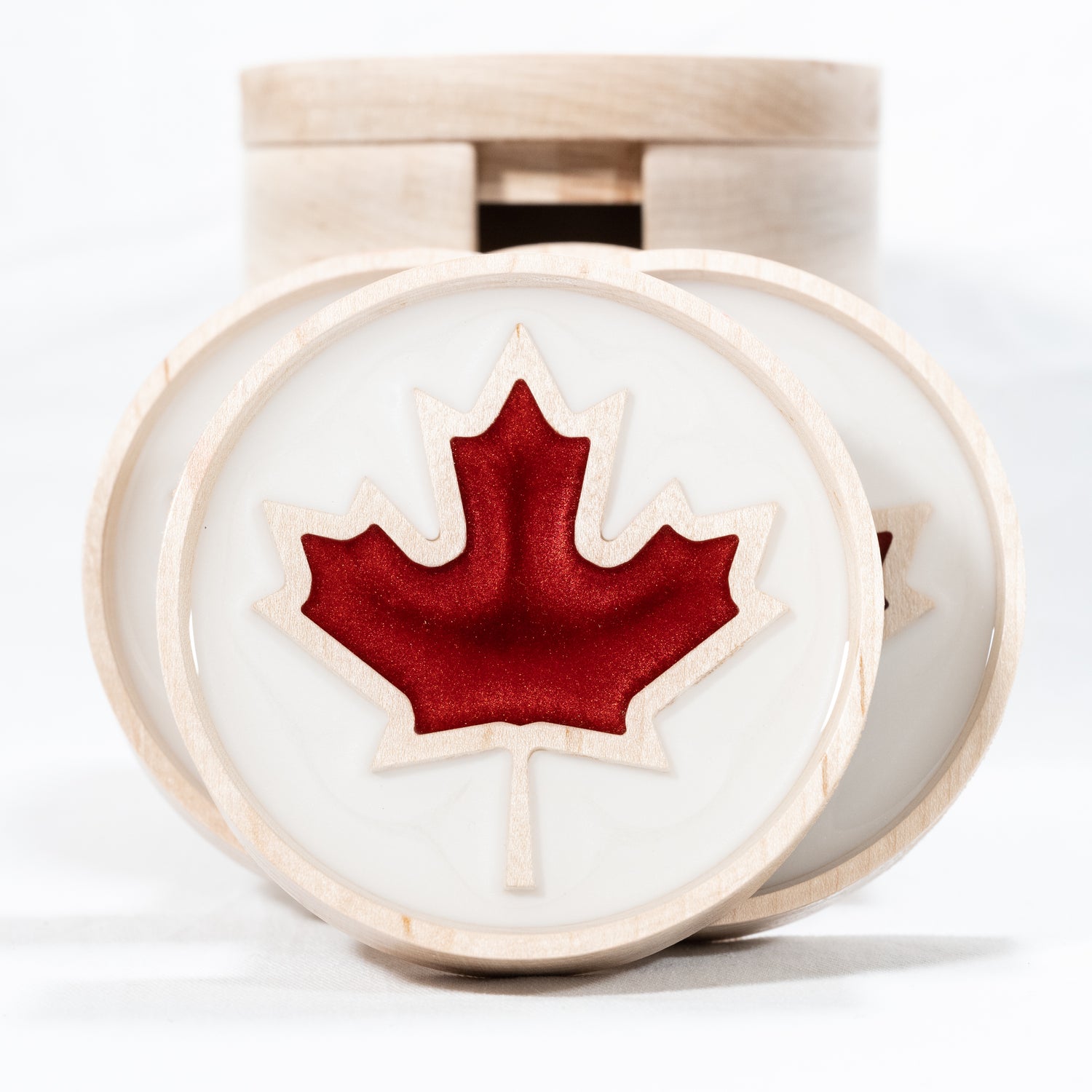 Maple coaster set with red resin maple leaf on white background