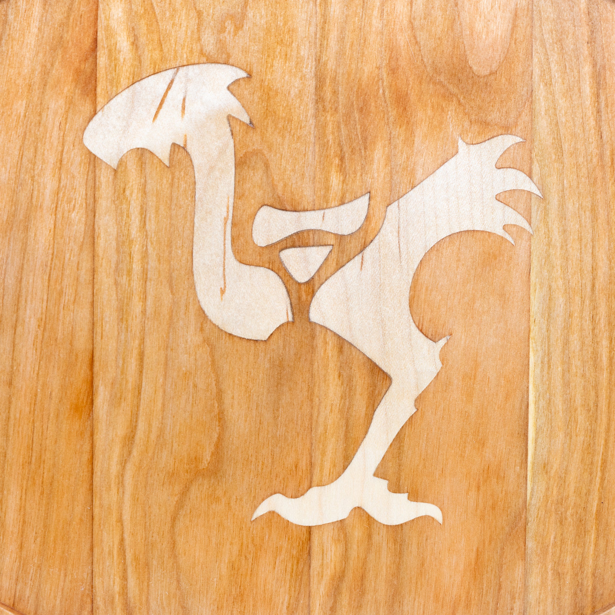 a handmade cherry wood platter with maple final fantasy chocobo inlay