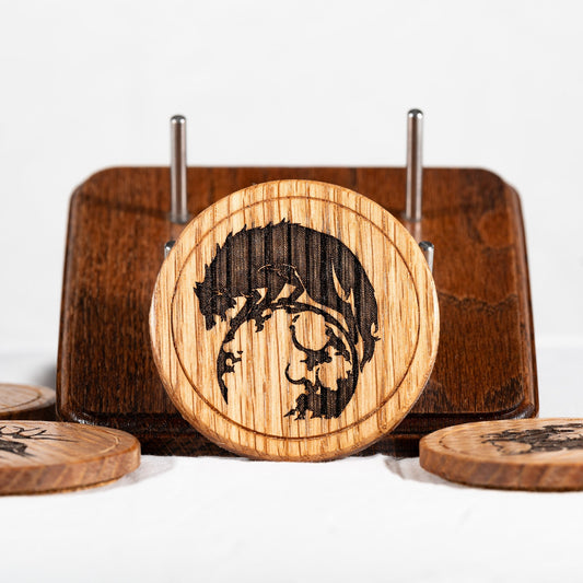 A handmade Red Oak wood coaster featuring the Ashen Wolves from Fire Emblem Three Houses