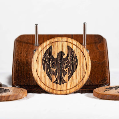 A handmade Red Oak wood coaster featuring the Black Eagles from Fire Emblem Three Houses
