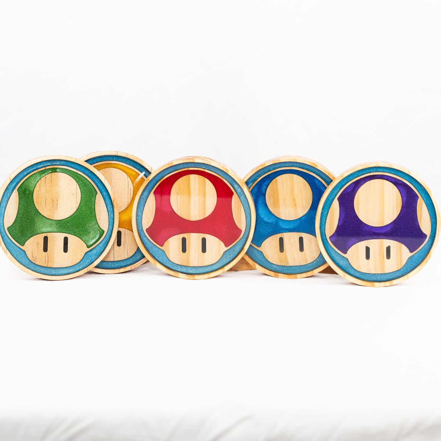 Handmade wood and purple, red, green, gold, and blue resin Mario mushroom drink coasters