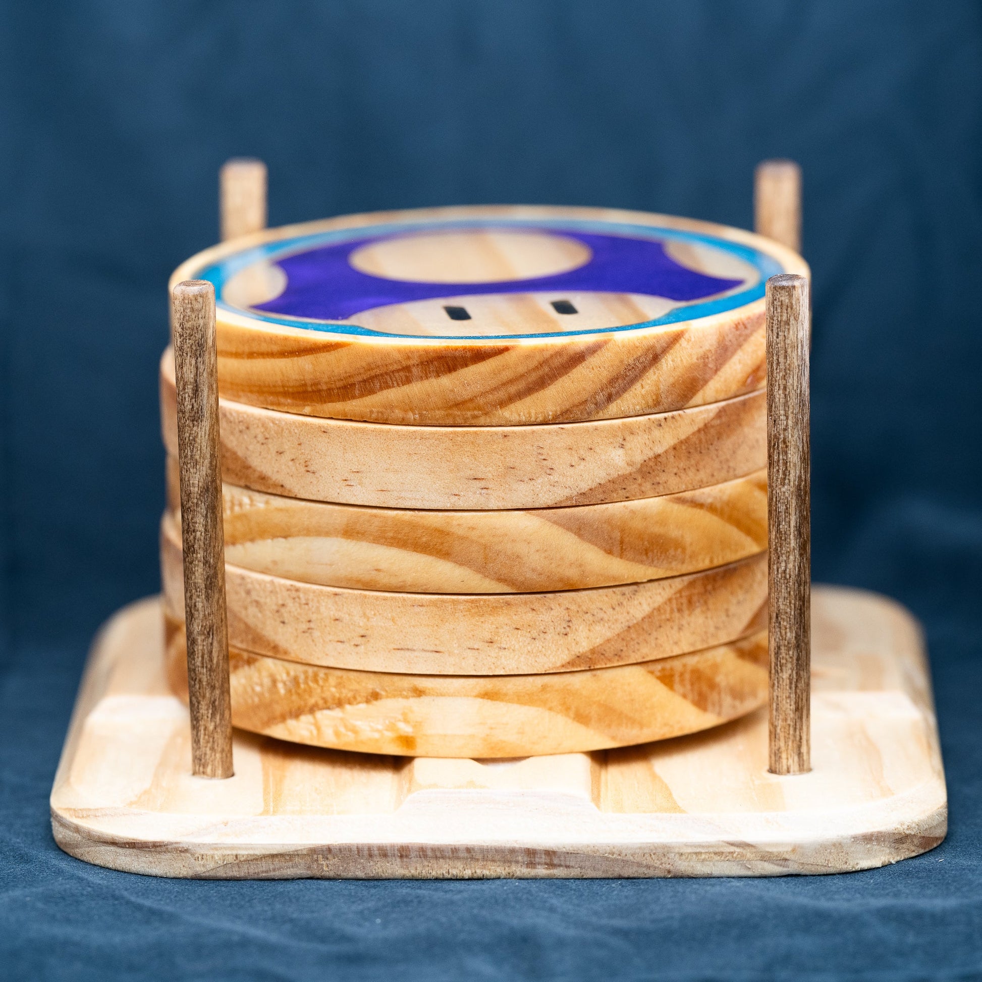 Handmade wood and purple, red, green, gold, and blue resin Mario mushroom drink coasters and wooden stand