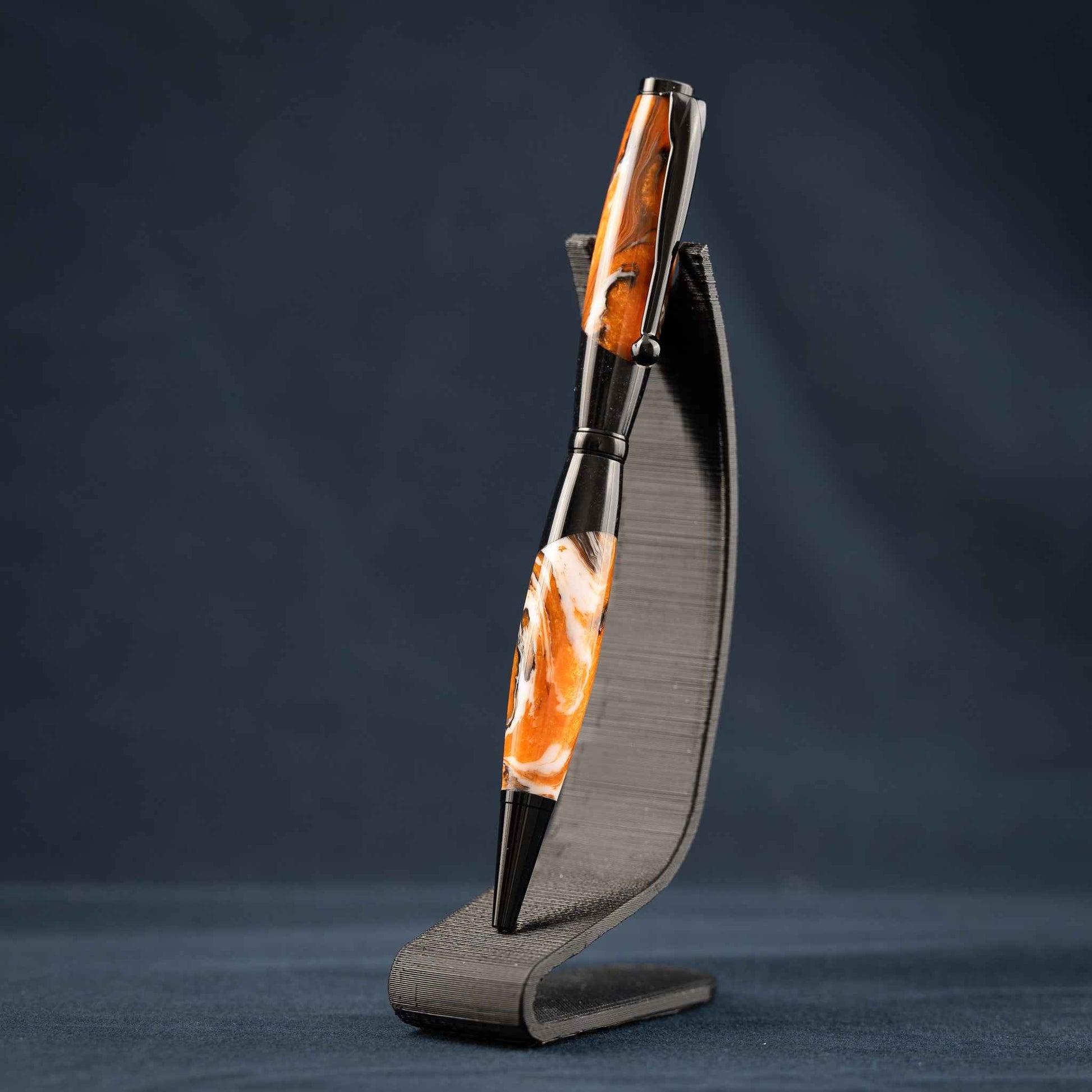 Orange, White, and Black Swirled Resin Twist Pen with Black Center Segment