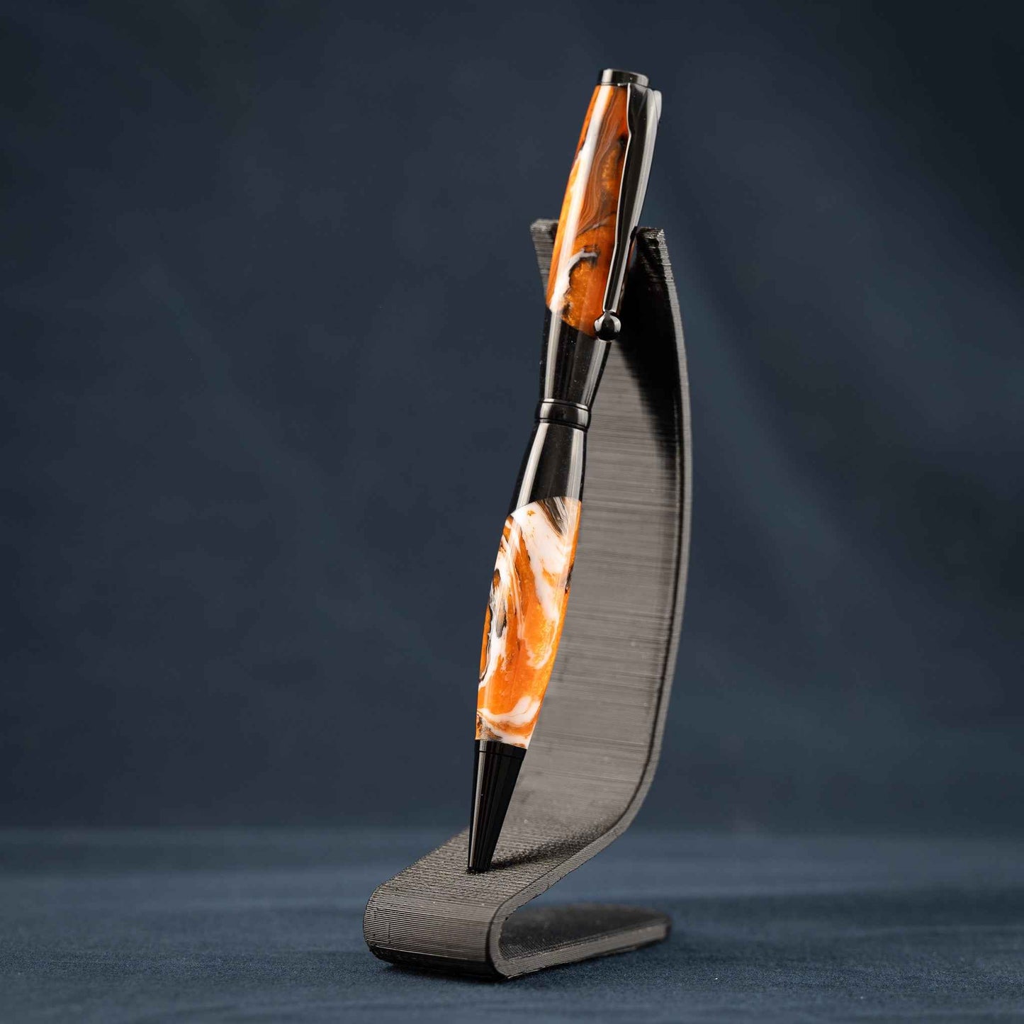 Orange, White, and Black Swirled Resin Twist Pen with Black Center Segment