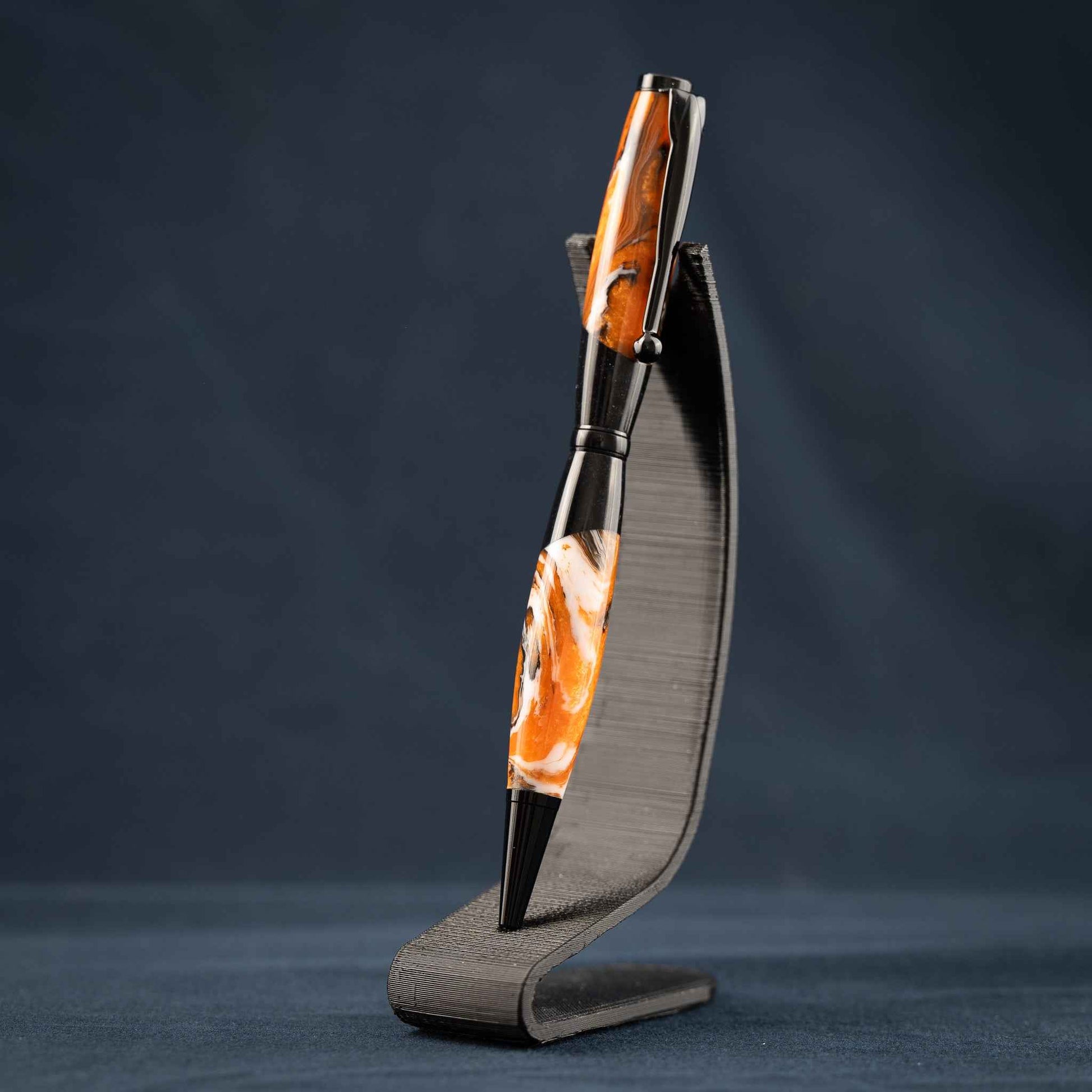 Orange, White, and Black Swirled Resin Twist Pen with Black Center Segment