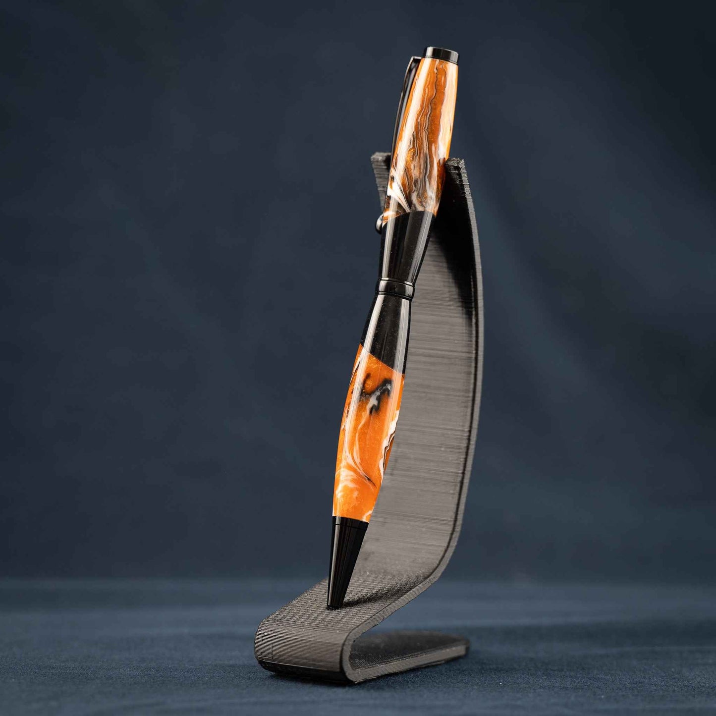 Orange, White, and Black Swirled Resin Twist Pen with Black Center Segment