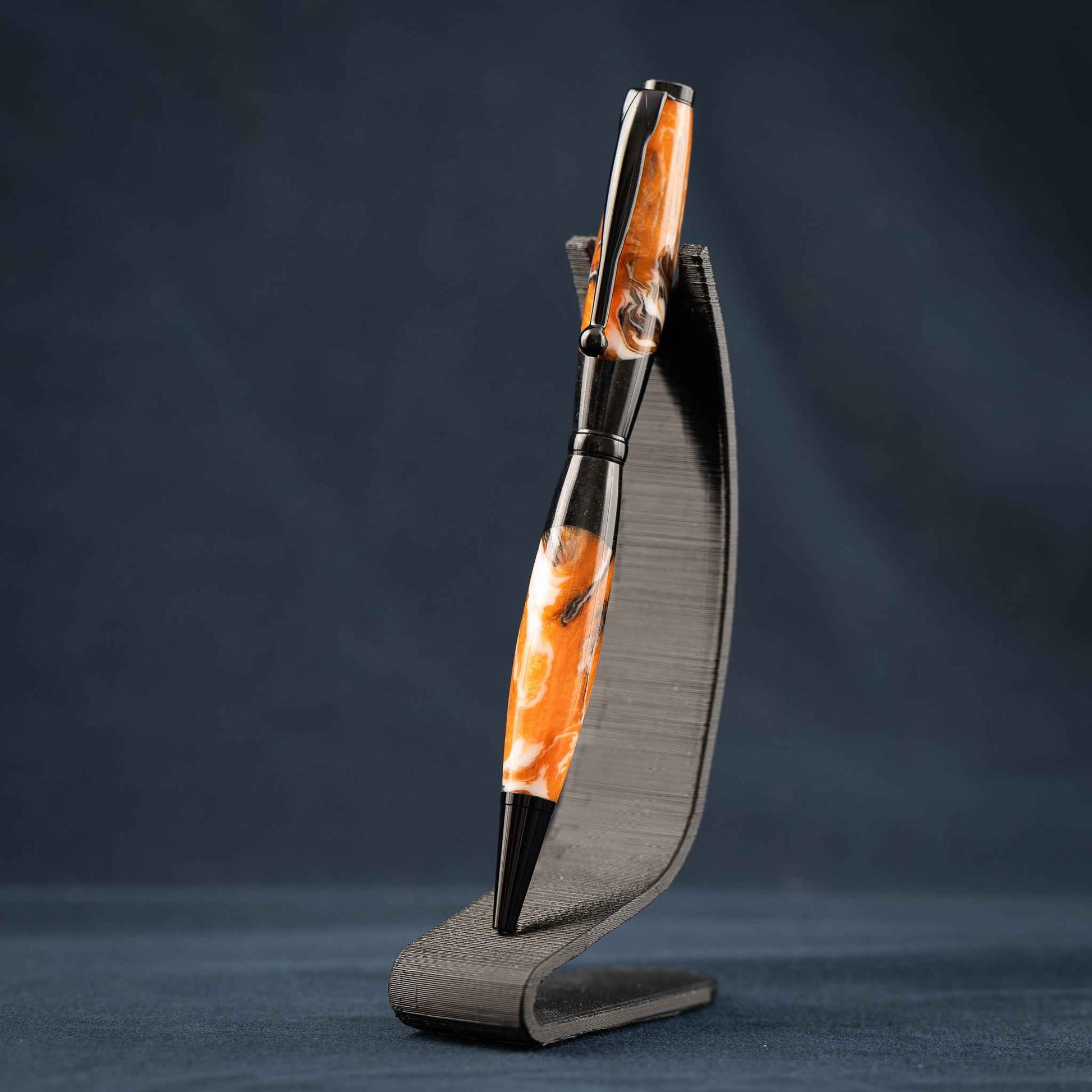 Orange, White, and Black Swirled Resin Twist Pen with Black Center Segment