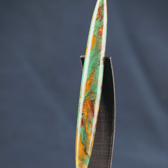 A short feature video of the creation of the green, gold, copper, and bronze desk pen.