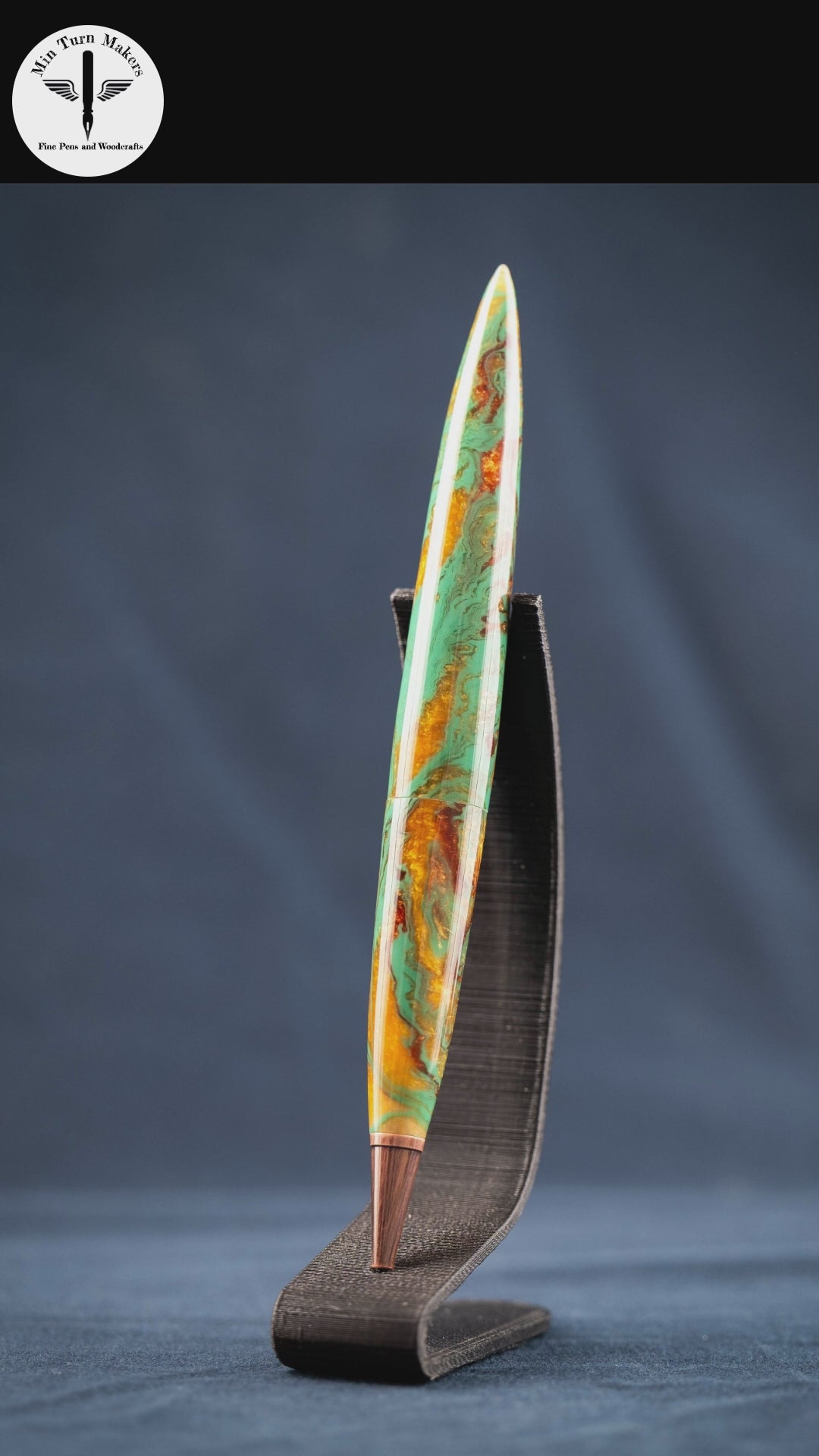 A short feature video of the creation of the green, gold, copper, and bronze desk pen.