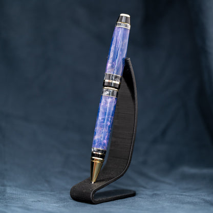 Handmade purple and grey resin ballpoint twist pen with brass veneer, gold plating, and black ink.