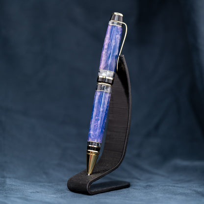 Handmade purple and grey resin ballpoint twist pen with brass veneer, gold plating, and black ink.