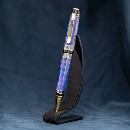 Handmade purple and grey resin ballpoint twist pen with brass veneer, gold plating, and black ink.