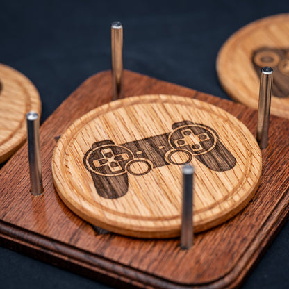 A handmade Red Oak wood drink coaster with Playstation video game controller design.