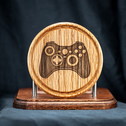 A handmade Red Oak wood drink coaster with Xbox video game controller design.