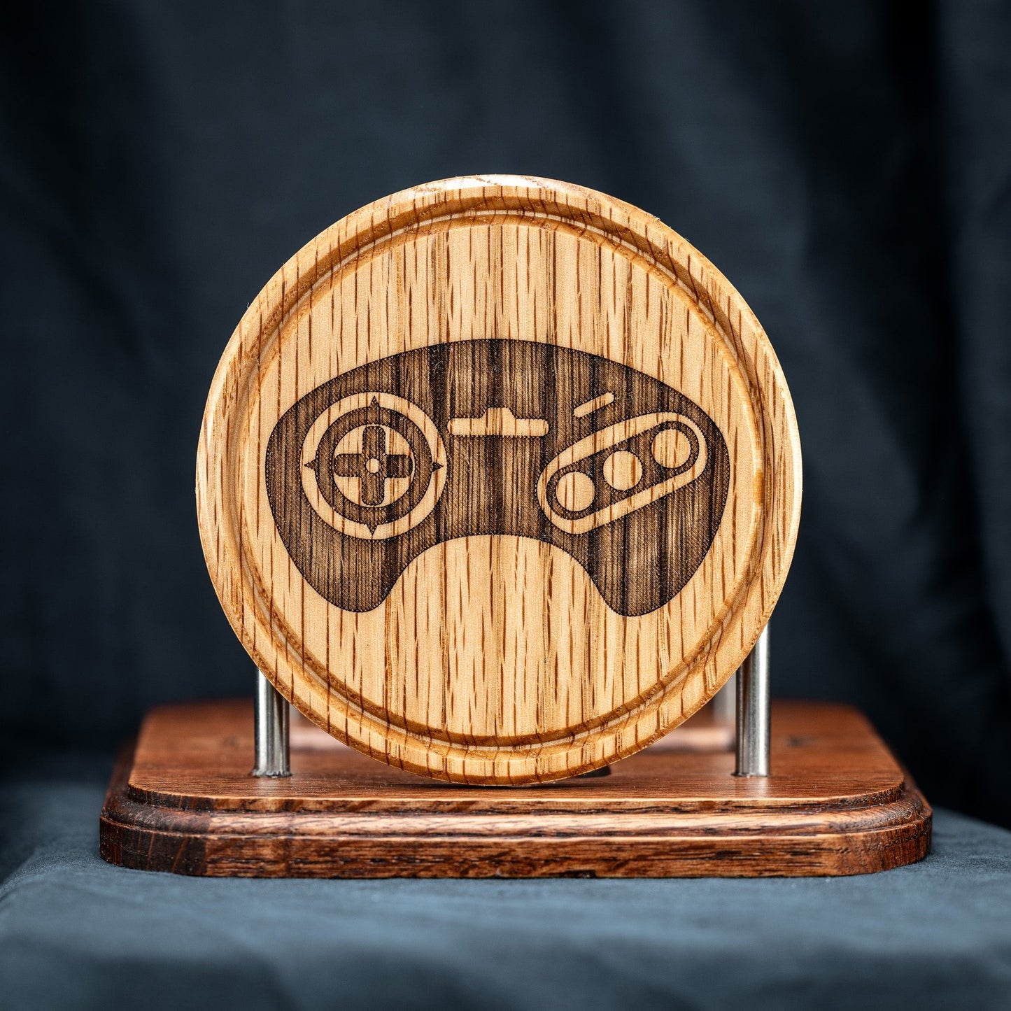 A handmade Red Oak wood drink coaster with Sega video game controller design.