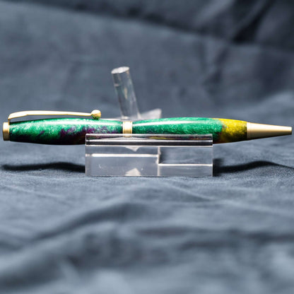 A handmade green, yellow, and purple resin ballpoint slimline twist pen with satin gold plating.