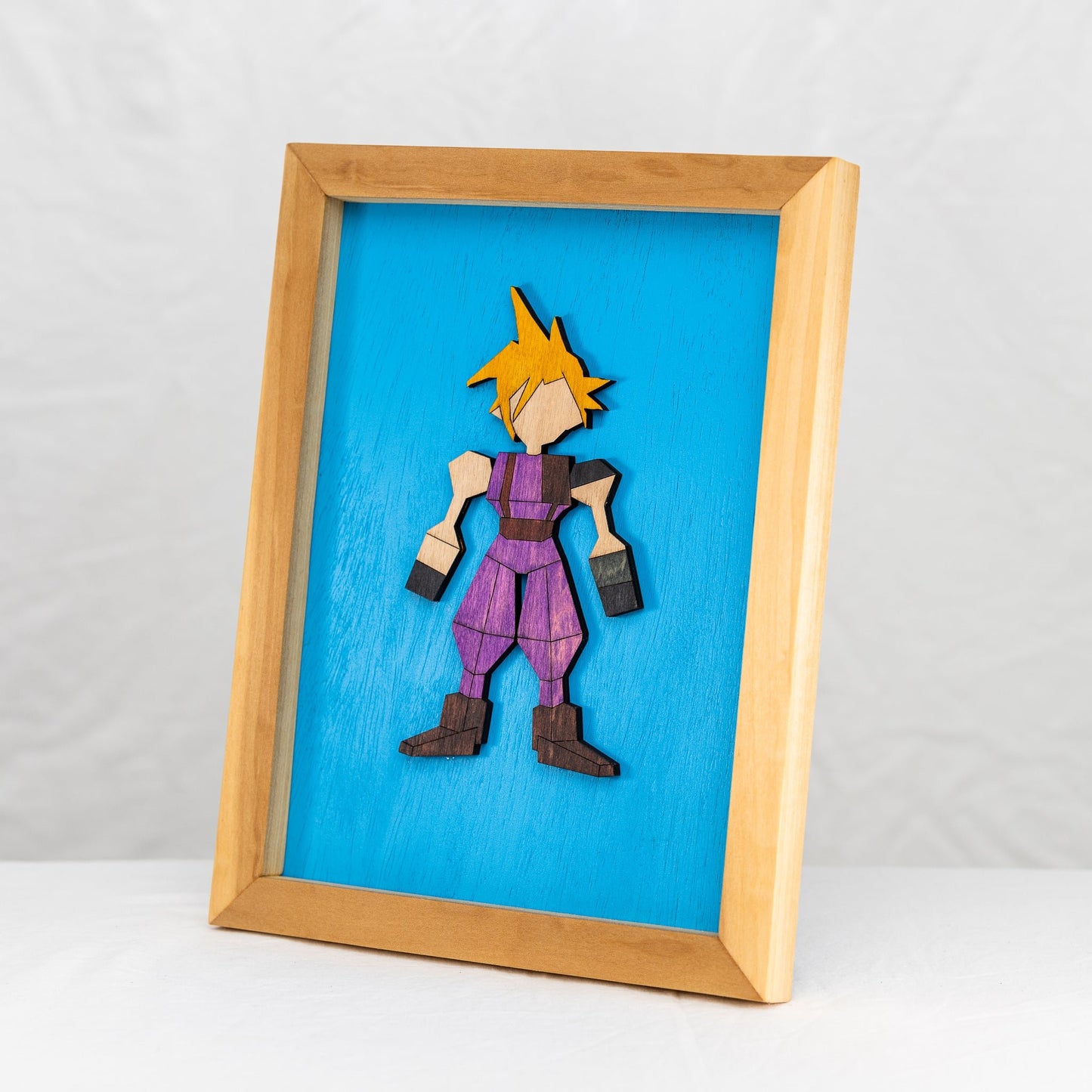 Handmade wooden Cloud Strife from the Final Fantasy VII video games in a Poplar wood frame.