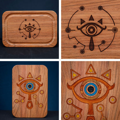 A handmade Jatoba wooden cutting board featuring the Sheikah eye from the Legend of Zelda video games in resin inlay.