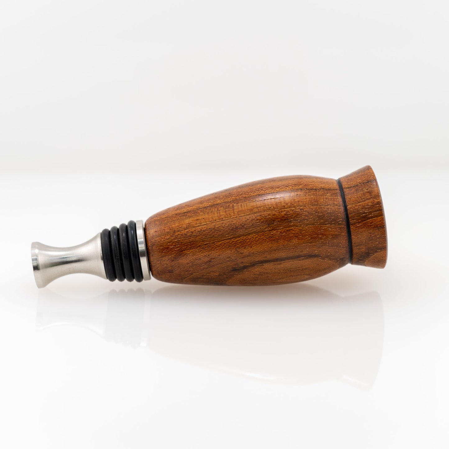 Handmade wood bottle stopper with purple resin topper and stainless steel bottom