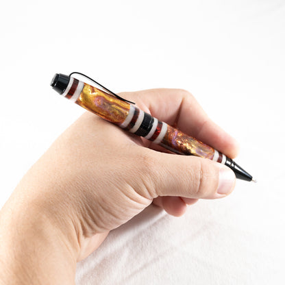 Handmade red, purple, gold, white segmented twist pen with black chrome plating