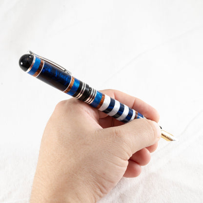 Handmade blue, white, bronze and dark blue resin highly polished with an Iridium plated fountain pen