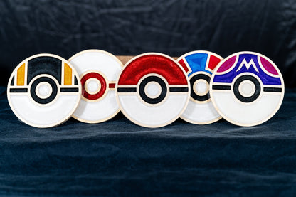 Set of five handmade carved wood and resin Pokémon Poké Ball drink coasters