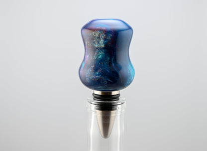 Handmade blue, silver, and white resin bottle stopper