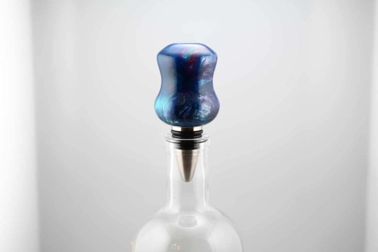 Handmade blue, silver, and white resin bottle stopper