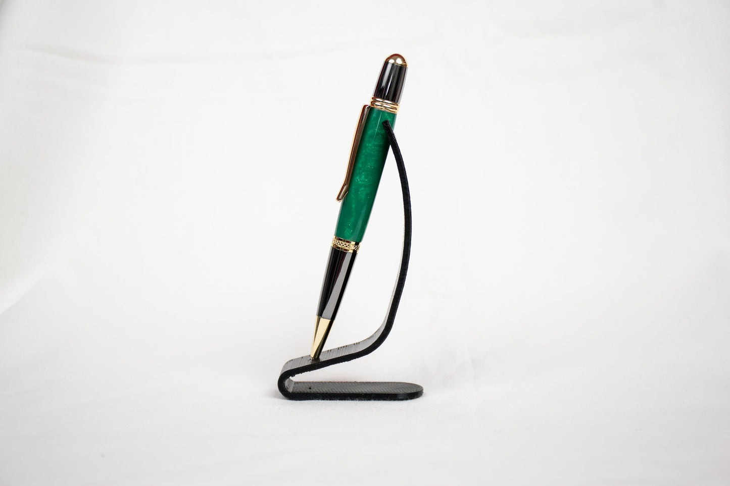 Handmade green and green sparkle resin twist pen with two-tone gunmetal and gold plating
