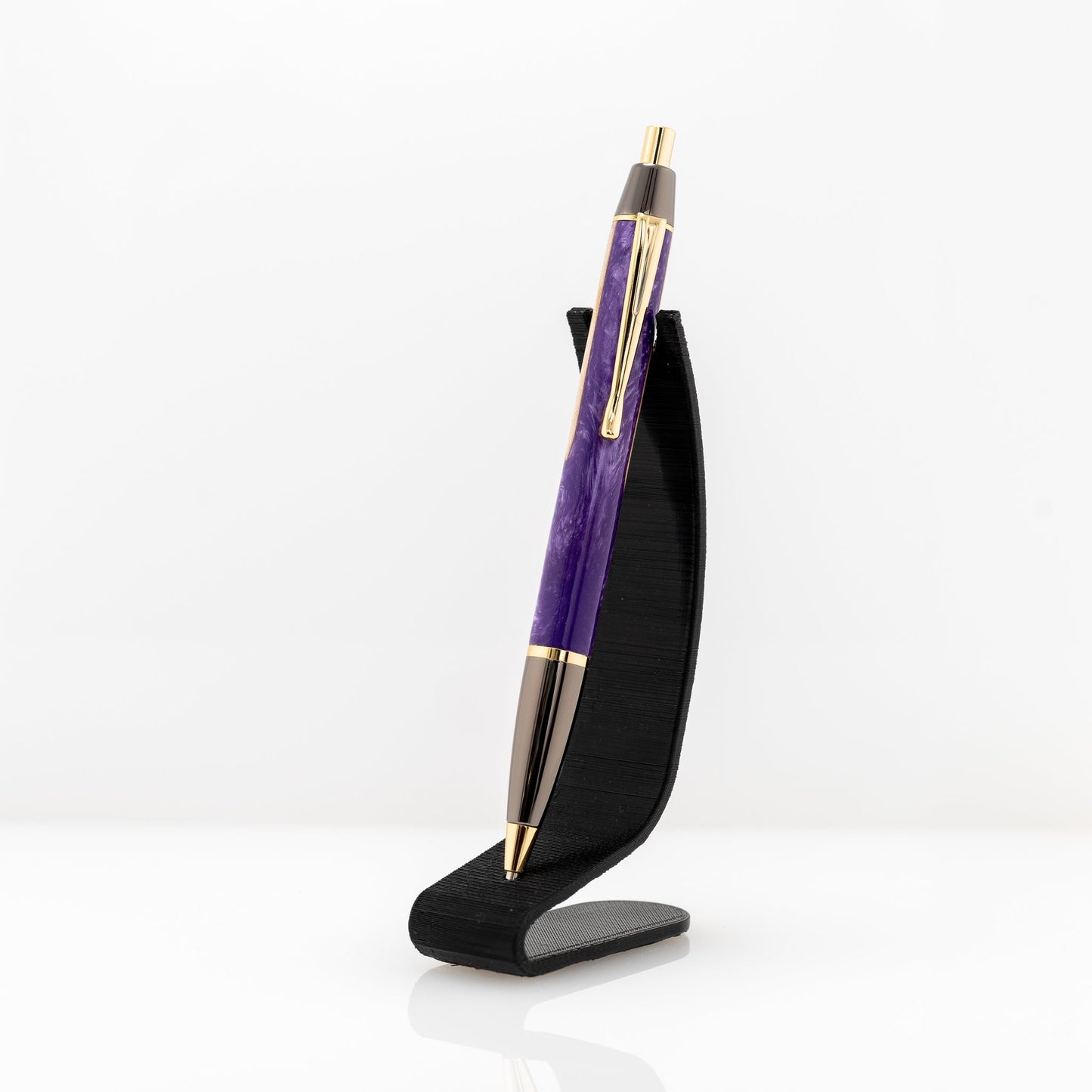 Handmade click pen with Maple wood surrounded by purple sparkle resin with gold and gunmetal plating