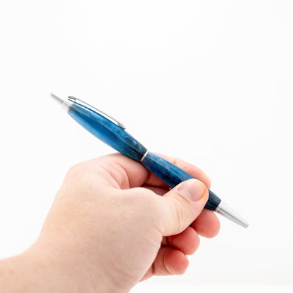 Handmade translucent color-shift blue over black slim resin click ballpoint pen with satin chrome plating