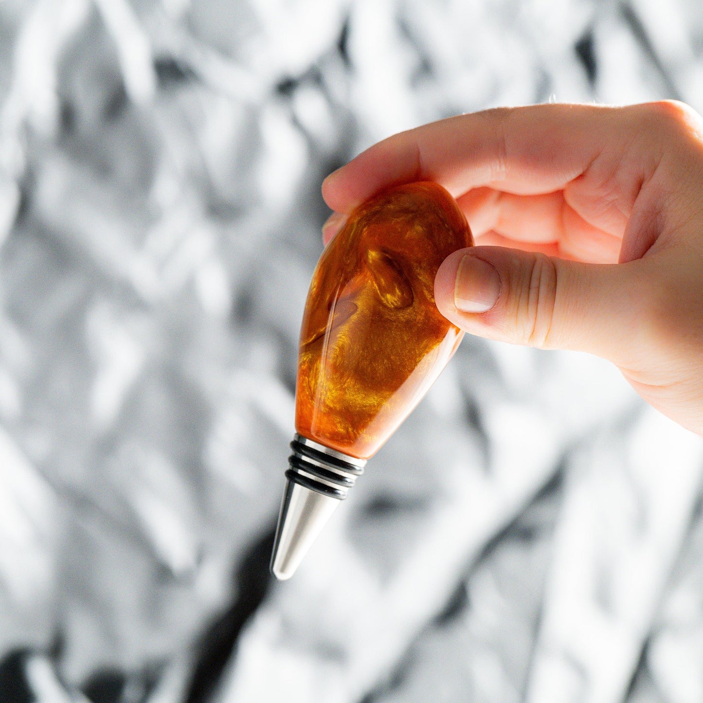 Handmade orange and gold resin swirl bottle stopper with a stainless steel dropper and silicon gaskets