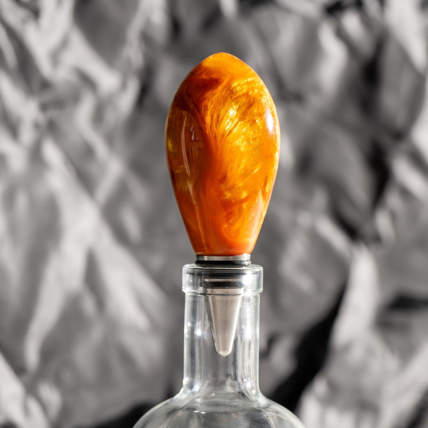 Handmade orange and gold resin swirl bottle stopper with a stainless steel dropper and silicon gaskets