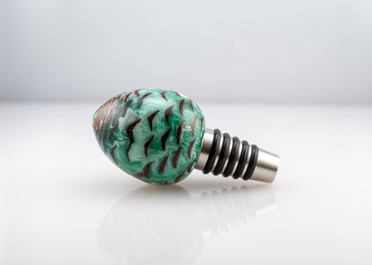 handmade pine cone and green and white resin bottle stopper