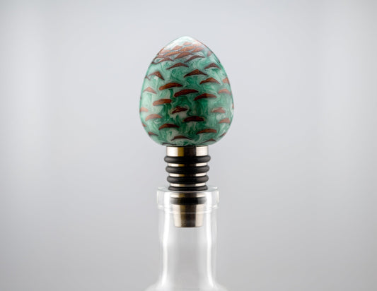 handmade pine cone and green and white resin bottle stopper