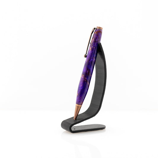 handmade modified slimline purple resin pen with copper plating on a black stand