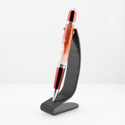 handmade white and red resin ballpoint twist pen with red prism plating on a black stand