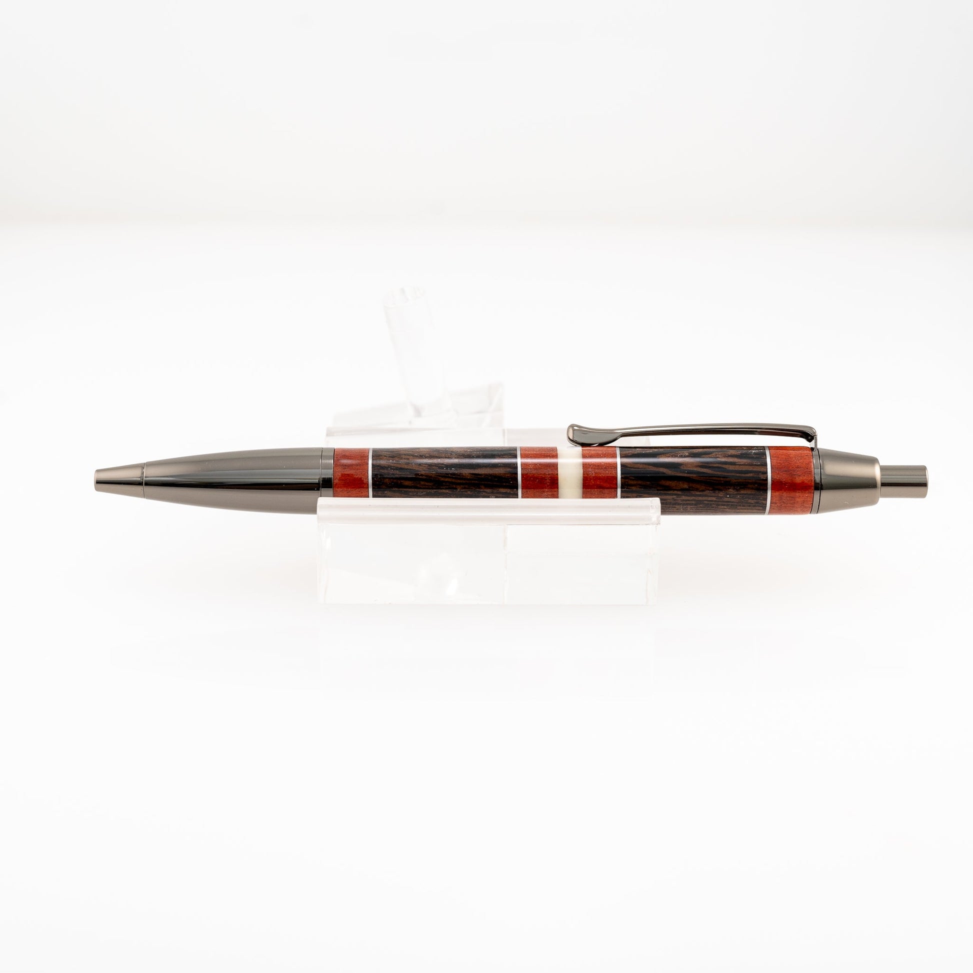 a handmade redheart, wenge, aluminum, and resin click pen 